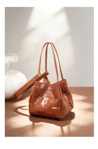 Detailed view of brown leather woven handbag, premium texture, elegant craftsmanship style.