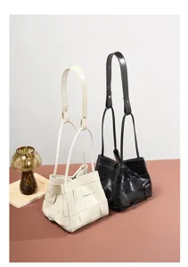 Genuine leather woven bucket handbag, stylish dual color shoulder bag for women commuting daily.