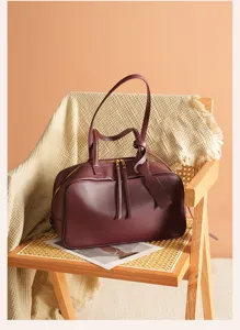 Burgundy leather Boston shoulder bag, large capacity commute bowling handbag for women.