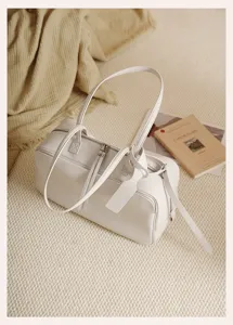 White leather Boston shoulder bag, large capacity commute handbag for women and daily use.