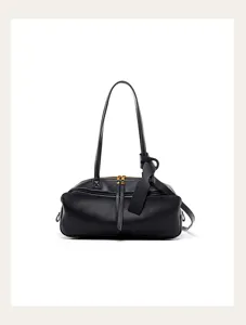 Black leather shoulder bag detail, stylish knotted strap and dual metal zippers design.