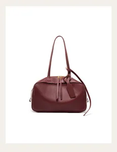 Burgundy leather Boston shoulder bag detail, elegant commuter handbag with zip closure.
