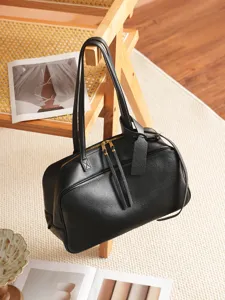 Black leather boston bag for women, large capacity shoulder handbag for daily commute style.