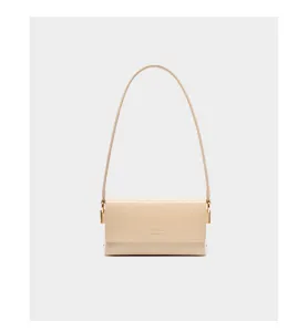 Minimalist beige leather shoulder bag detail, elegant underarm purse with sleek metal hardware.