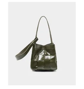 Detailed view of the dark green woven leather bucket bag, showcasing premium craftsmanship and texture.