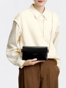 Classic minimalist black leather chain crossbody bag for women, elegant daily commute main view.