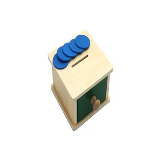 Wooden Montessori coin drop box toy with drawer and blue tokens for early learning and skills.