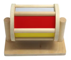 Wooden Montessori spinning drum toy detail, colorful sensory roller with mirror for kids.