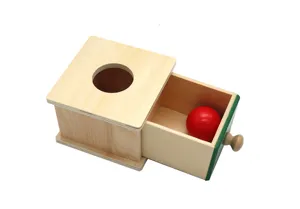 Wooden Montessori ball drop box toy with drawer for early childhood education and kids learning.