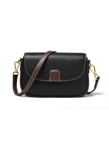 Classic black leather crossbody bag with brown strap and elegant contrast stitching for women.