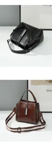 Minimalist genuine leather crossbody bag for women, large capacity, elegant design, detail view.