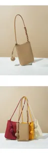 Detailed view of the genuine leather vertical phone bag with trendy knotted strap, elegant and chic.