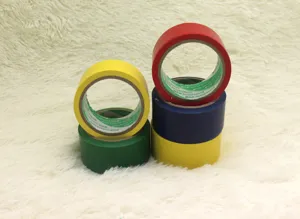 Colorful PVC tape rolls detail shot showing vibrant red, yellow, blue and green colors.