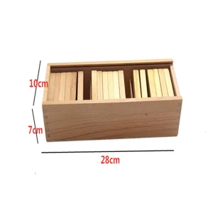 Wooden Montessori weight sorting box detail view showing internal wooden sensory tablets clearly.