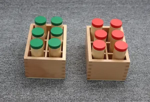 Detail view of Montessori wooden sound cylinders sensory training educational toy set.