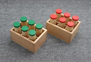 Montessori sensory sound cylinders wooden toy, detail view of audio discrimination learning aids.