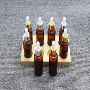 Detail view of amber glass dropper bottles with wooden base for sensory training and science.