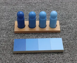 Montessori wooden color matching toy detail showing four blue gradient peg dolls and color tablet.