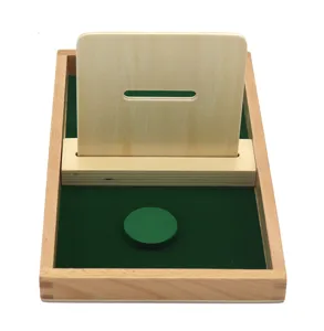 Wooden Montessori disc dropping toy detail, natural wood and green felt tray for early education.
