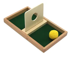 Montessori wooden ball insertion board toy with tray for early childhood education and training.