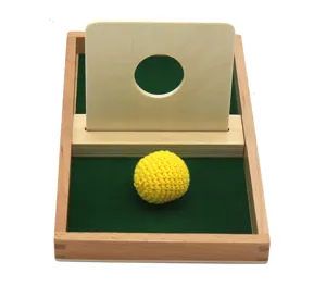 Wooden Montessori early education toy tray with hole board and yellow ball for kids.