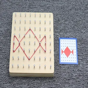 Detail of wooden geoboard educational toy with red rubber bands for math and geometry learning.