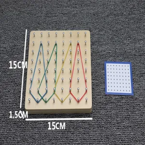 Wooden geoboard math educational toy with colorful rubber bands and instruction card for kids learning.