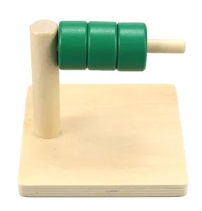 Wooden Montessori educational toy with stacking green cylinders for early childhood learning.