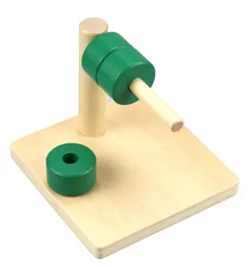 Wooden Montessori toy detail showing colored rings on peg base for early childhood learning.