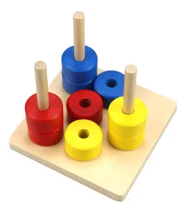 Detail shot of wooden Montessori sorting and stacking toy with colorful rings for early childhood.