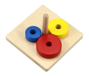 Wooden Montessori early education toy detail showing square base, peg and colored rings.
