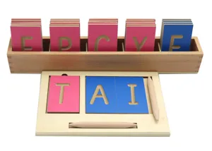 Montessori wooden movable alphabet spelling board detail shot showing colorful letter cards.