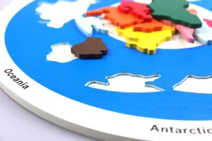 Close-up detail of the colorful wooden geography puzzle board for kids early education toys.
