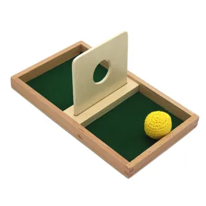 Wooden Montessori early education toy with tray, hole board and yellow ball for kids.