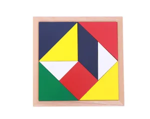 Wooden tangram puzzle detail, colorful geometric shape pieces in square wooden tray.