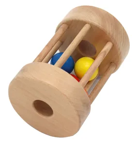 Wooden rolling drum toy detail featuring colorful balls inside for baby sensory training.
