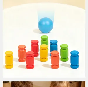 Detailed view of colorful wooden cylinders and blue ball for Montessori early education training.