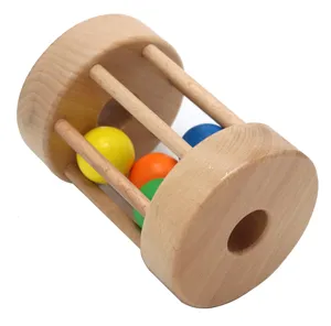 Wooden rolling drum baby toy detail view, educational Montessori toy with colorful balls.