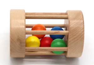 Wooden rolling drum detail showing colorful balls inside, Montessori early education toy.