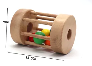 Wooden rolling drum baby toy with colorful balls inside, early educational sensory training tool.