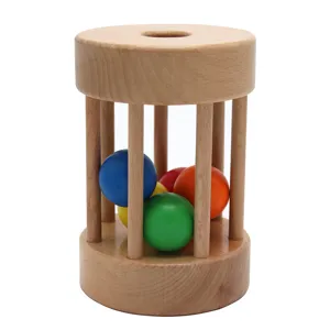 Montessori wooden rolling drum toy with colorful balls for infant early education and training.
