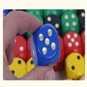 Close-up detail of a colorful wooden dice with clear pips, solid and durable for game use.
