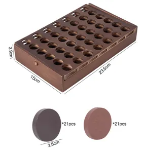 Wooden four in a row board game detail view, carbonized wood storage box and game pieces.