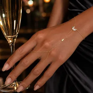 Delicate gold hand chain bracelet with rhinestone leaf design, elegant party hand jewelry.