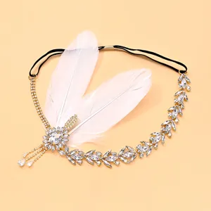 Vintage 1920s Gatsby feather rhinestone headband tassel crystal hair accessory detail shot