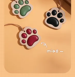 Cute leather cat paw charm pendant for car rearview mirror, bag decor and keychain.