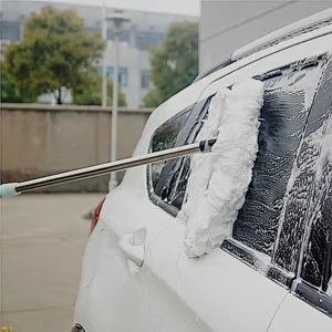 Detail view of the long-handled telescopic car wash mop cleaning with rich foam effortlessly.