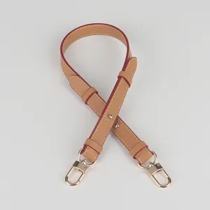 Adjustable leather replacement bag strap in tan with gold hardware and chic red edge details.
