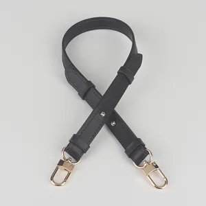 Adjustable black leather bag strap replacement with gold metal hardware, ideal for shoulder bags.