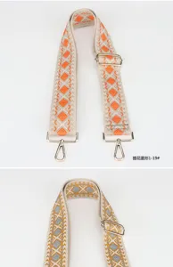Adjustable woven bag strap with colorful diamond pattern, wide replacement strap detail.